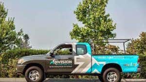 side view of one of Envision Painting's branded trucks